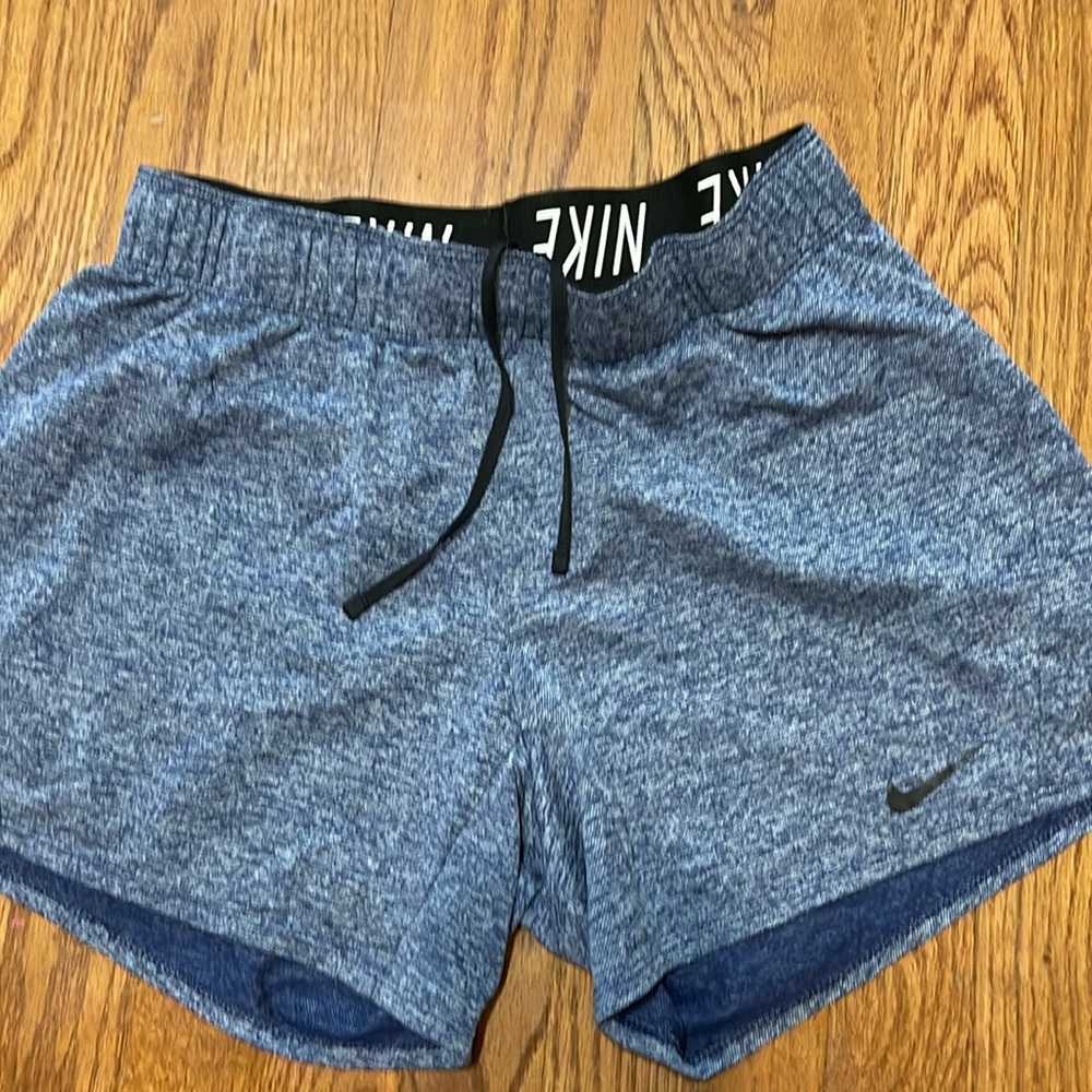 Ladies Nike Dri-Fit Blue Size  Small Shorts with elastic drawstring waistband.